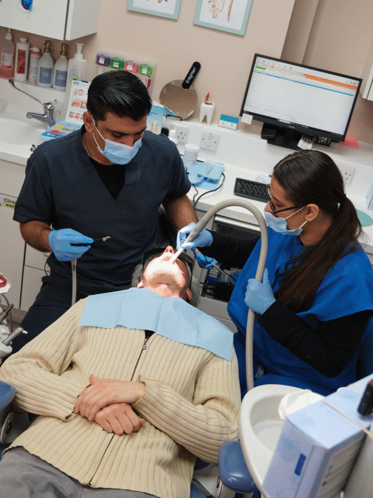 Dr Asad and our dental nurse during a dental hygiene appointment in Leicester