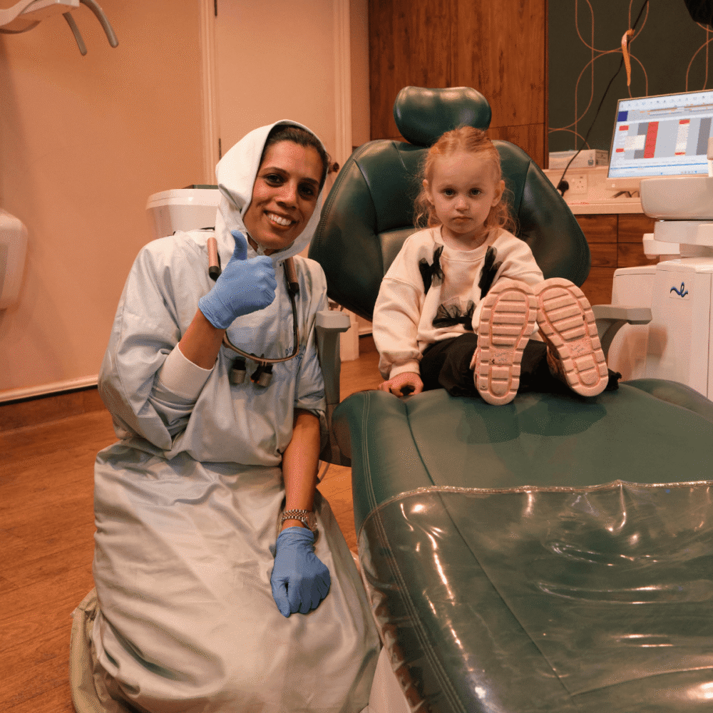 Dr Zeinab and a child during a paediatric dentist appointment